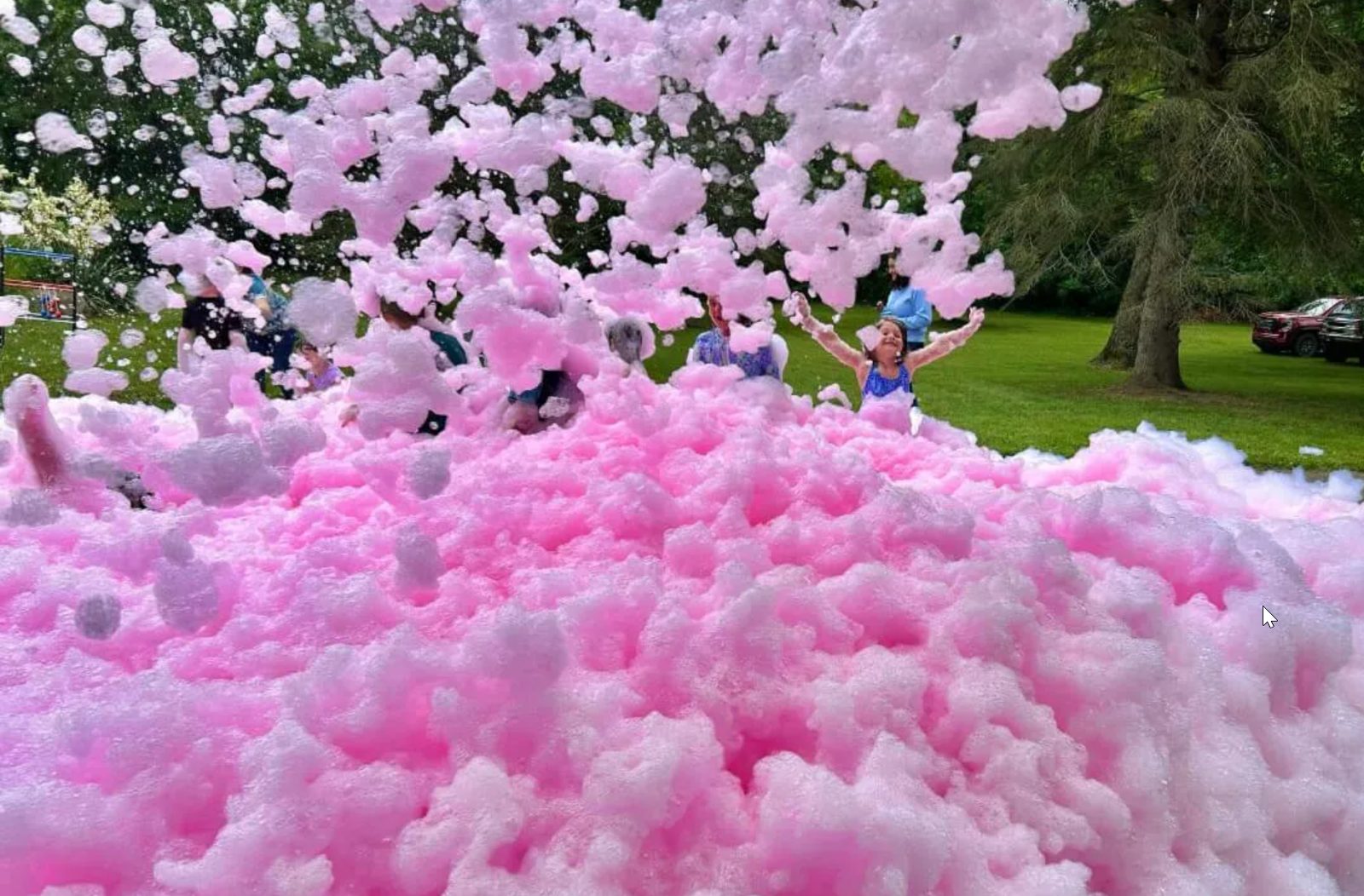 Pink foam blasting from a gender reveal party